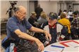 Veterans Steve Myers and John Schmidt chat at the Veterans Day Luncheon 11.11.22