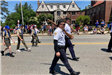 Boy Scouts and American Legion Rifle Squad march in the 2022 Memorial Day Parade