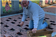 Nick Carlucci of C&A Masonry installed newly engraved bricks on the Veterans Memorial Walkway