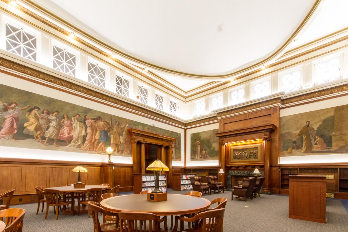 Library Mural Room Seating Area with Tables and Fireplace Area