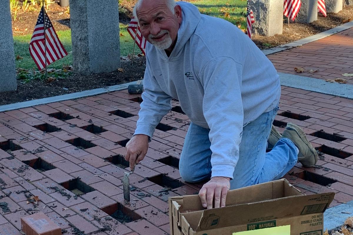Nick Carlucci of C&A Masonry installed newly engraved bricks on the Veterans Memorial Walkway - November 2021 