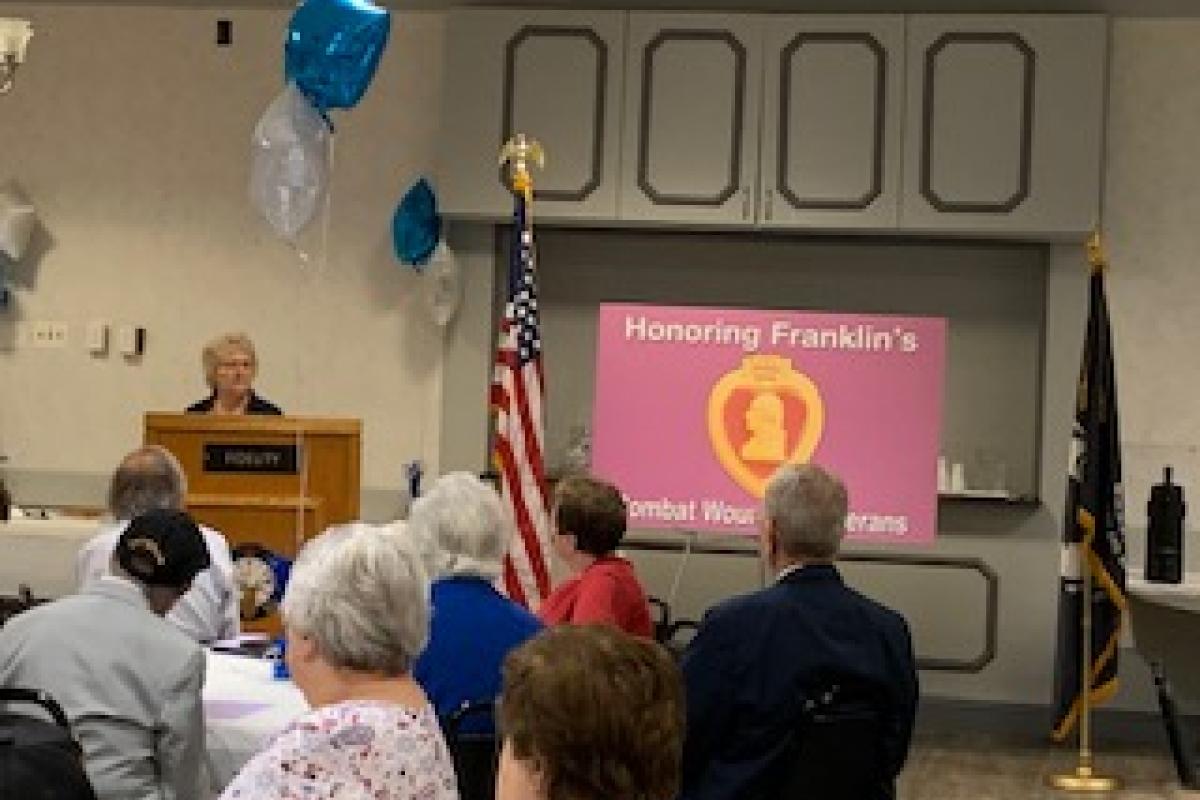 Theresa Perreault, the Massachusetts State Coordinator from the Quilts Of Valor Foundation, awarded quilts to several Franklin veterans at the 2021 Purple Heart Day Luncheon.