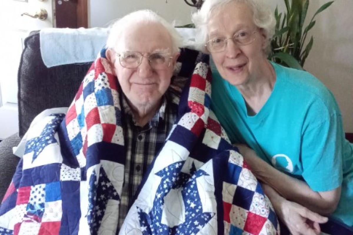 Korean War Veteran David Seyfarth, shown with his wife Jeanne, received a Quilt of Honor from the National Quilts of Honor Foundation in July 2023.    