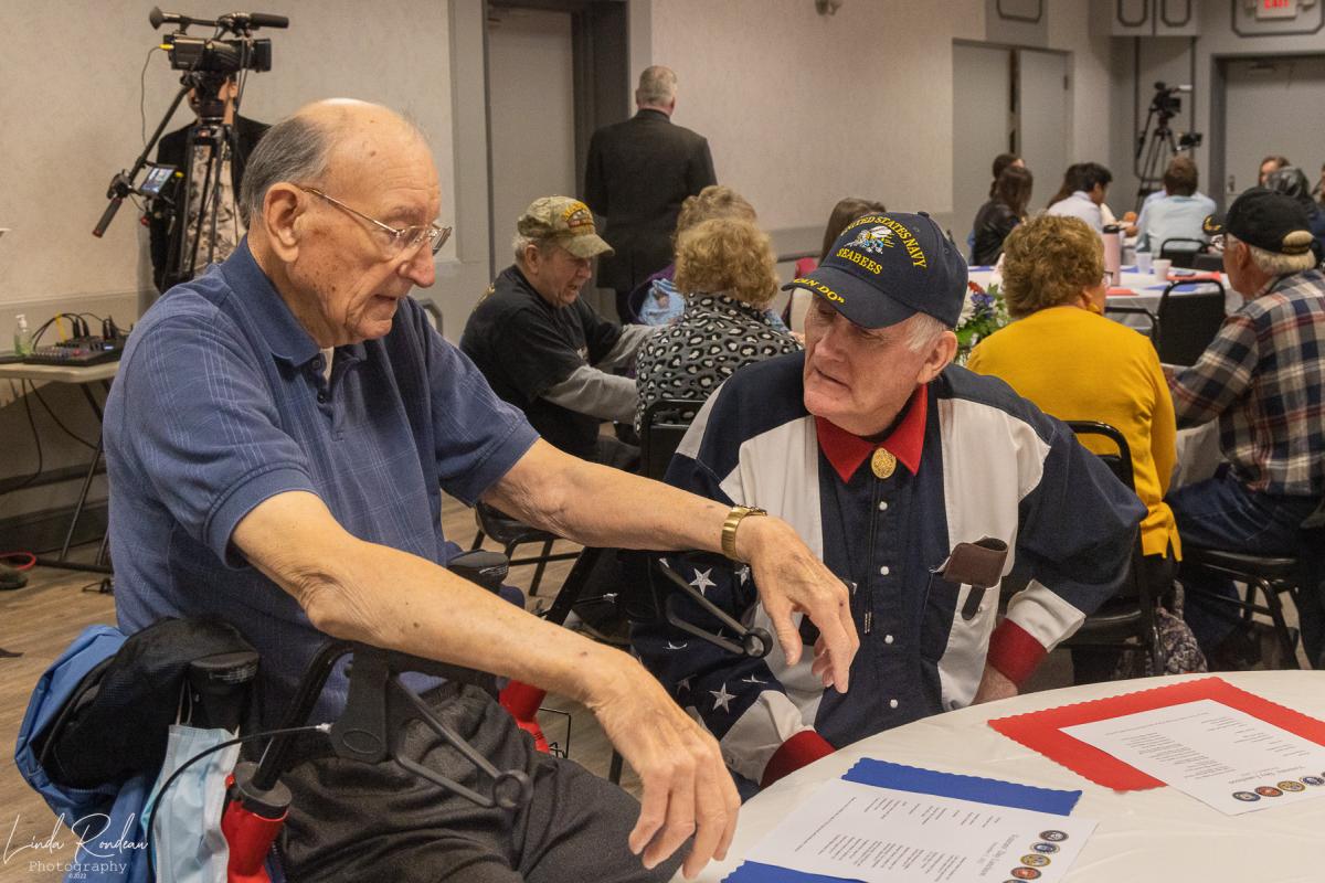 Veterans Steve Myers & John Schmidt chat at the Veterans' Day Luncheon 11.11.22